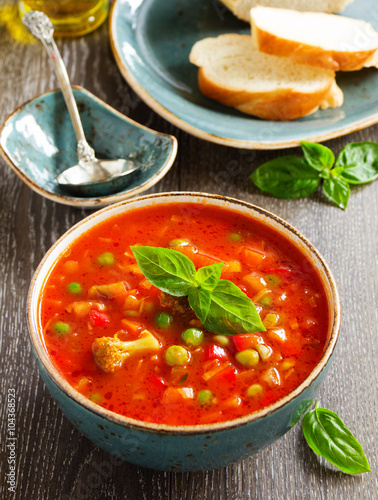 Bowl of minestrone soup with bread