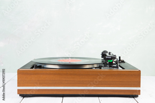vintage music player turntable with lp photo