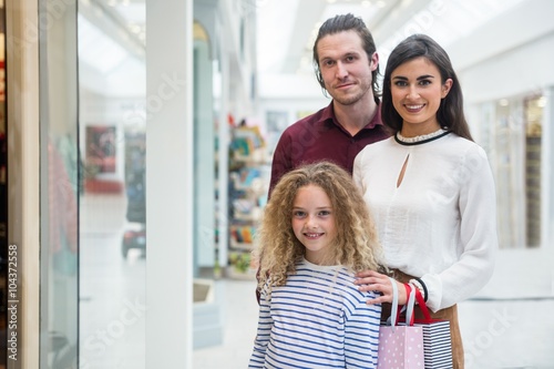 Portrait of happy family in shopping mall