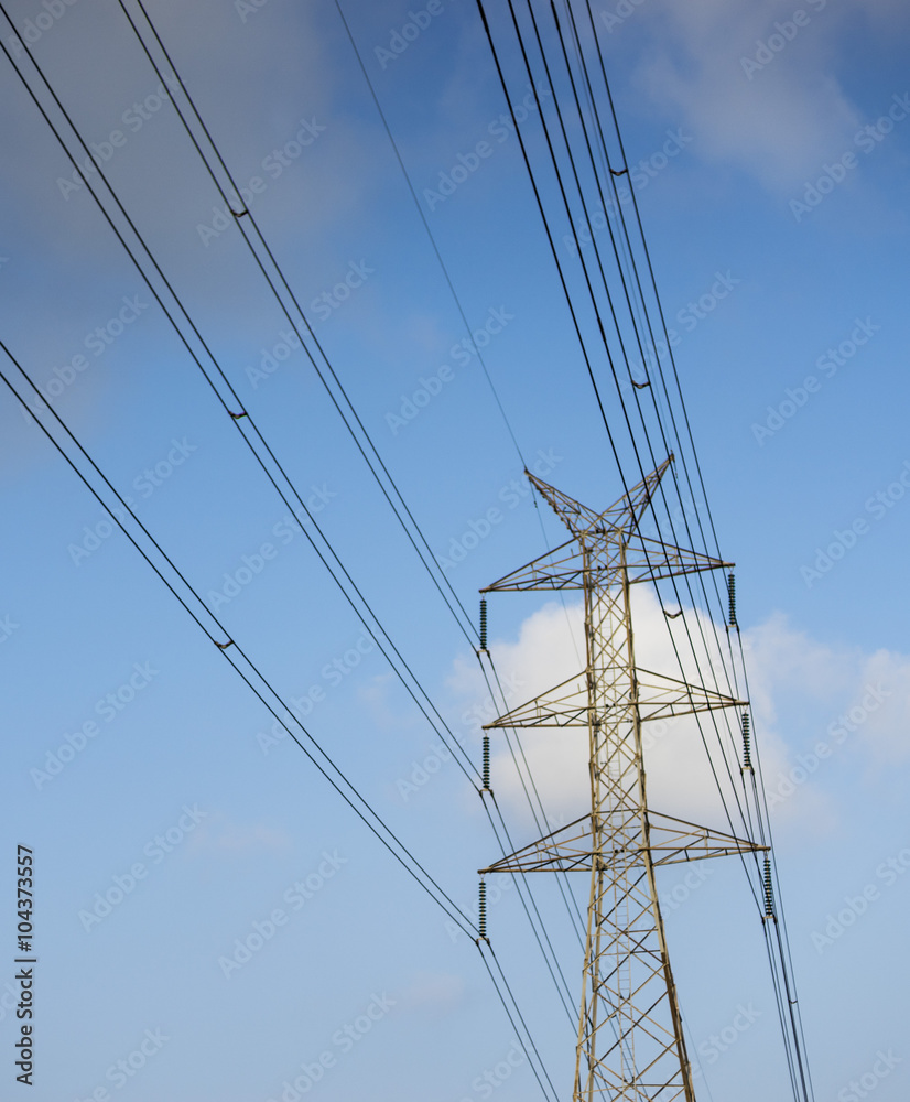 high voltage post with wire in blue sky
