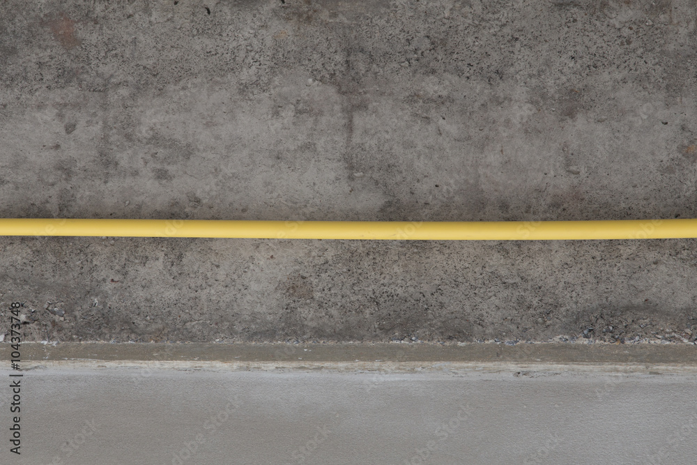 Fototapeta premium yellow PVC pipes for electrical boxes and wires buried on concre