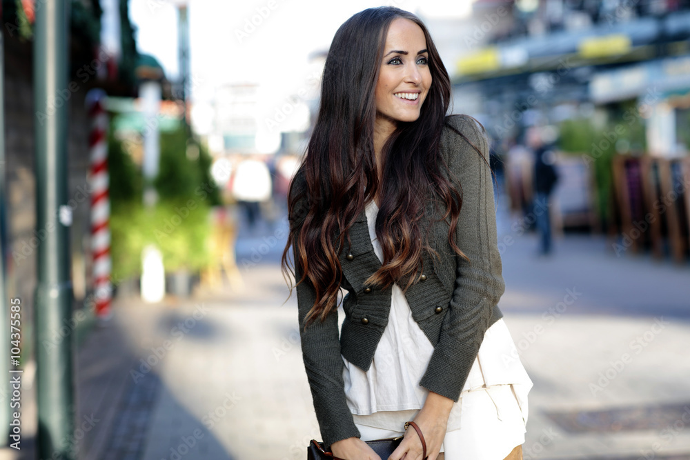 Portrait of smiling young woman with long brown hair Portrait of smiling young woman with long brown hair