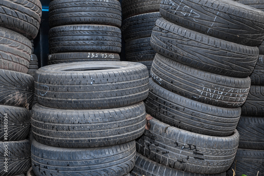 Picture closeup on hands choosing a tire or tyre Picture closeup on hands choosing a tire or tyre