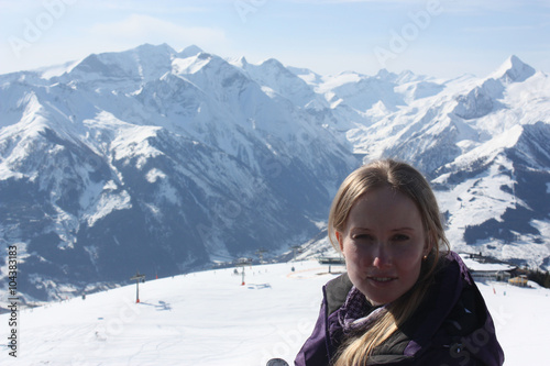 Young beautiful woman face. Zell am See, skiing resort in Alps. 