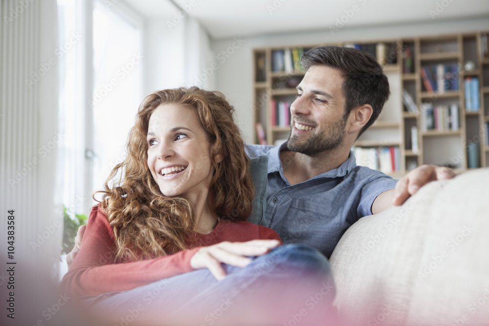 Relaxed couple at home on couch Relaxed couple at home on couch