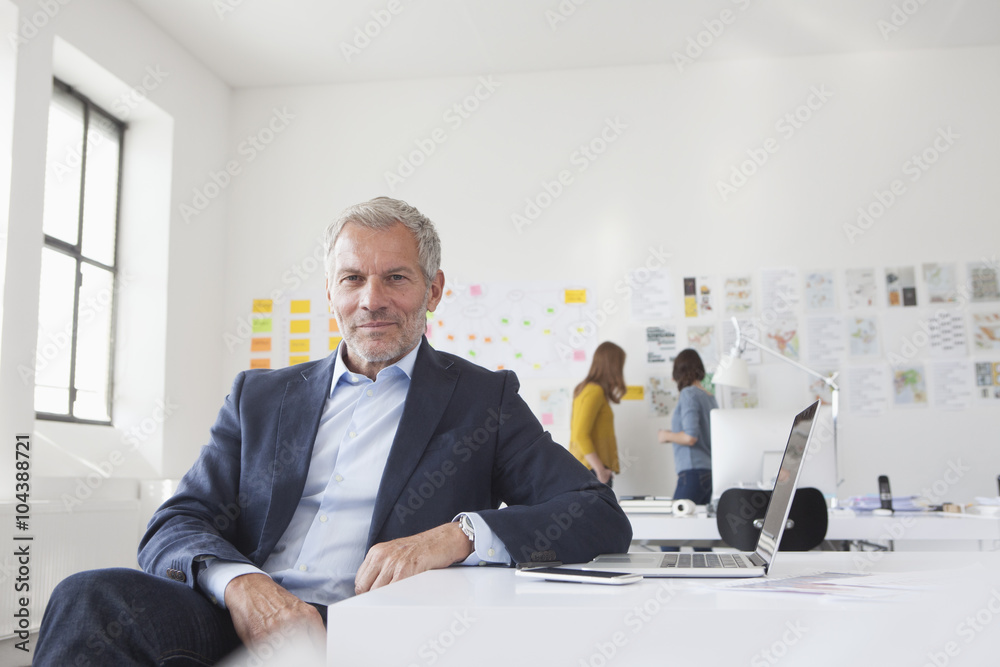 Portrait of confident businessman in office Portrait of confident businessman in office