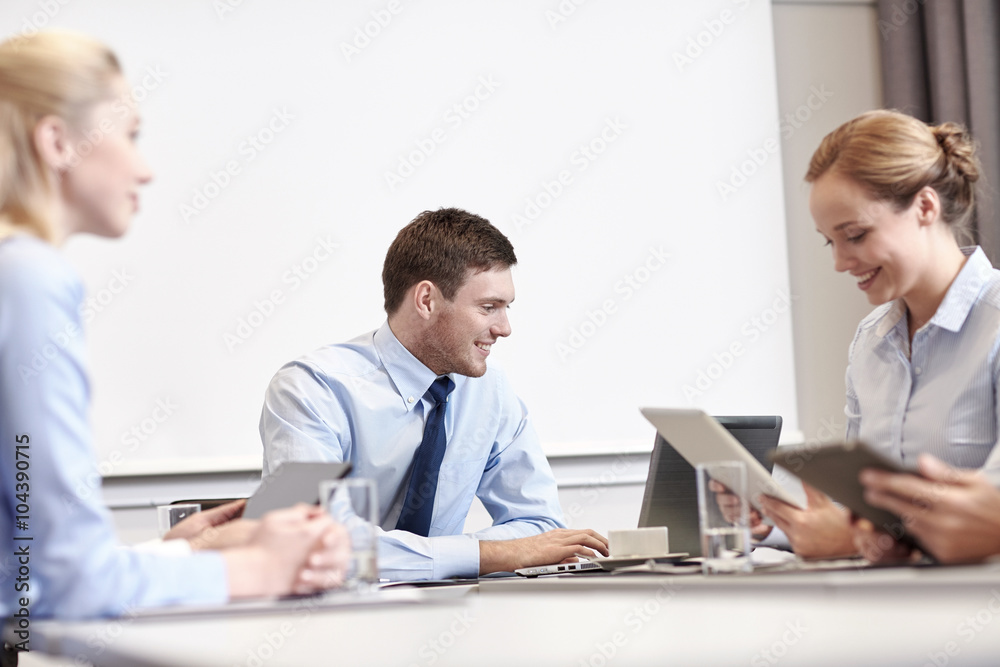 smiling business people with tablet pc in office smiling business people with tablet pc in office