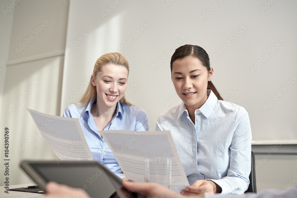 smiling businesswomen meeting in office smiling businesswomen meeting in office