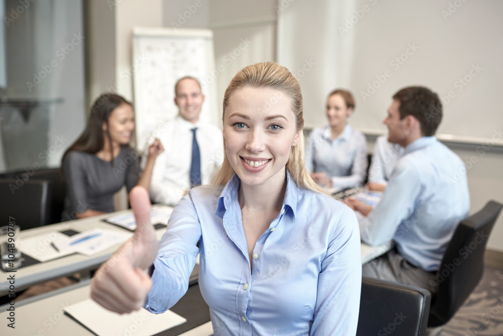 group of smiling businesspeople meeting in office group of smiling businesspeople meeting in office