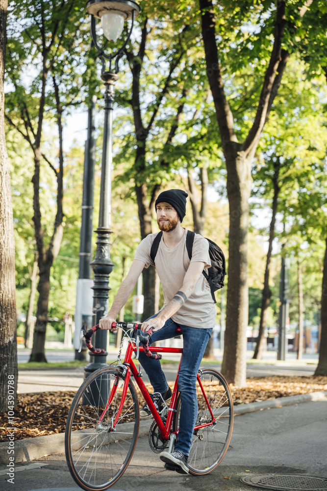 Young man with racing cycle on bicycle lane in Vienna, Dr.-Karl-Renner-Ring Young man with racing cycle on bicycle lane in Vienna, Dr.-Karl-Renner-Ring
