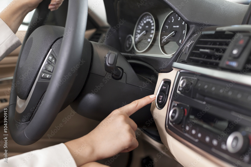 At the car dealer, Woman inside new car, close-up At the car dealer, Woman inside new car, close-up