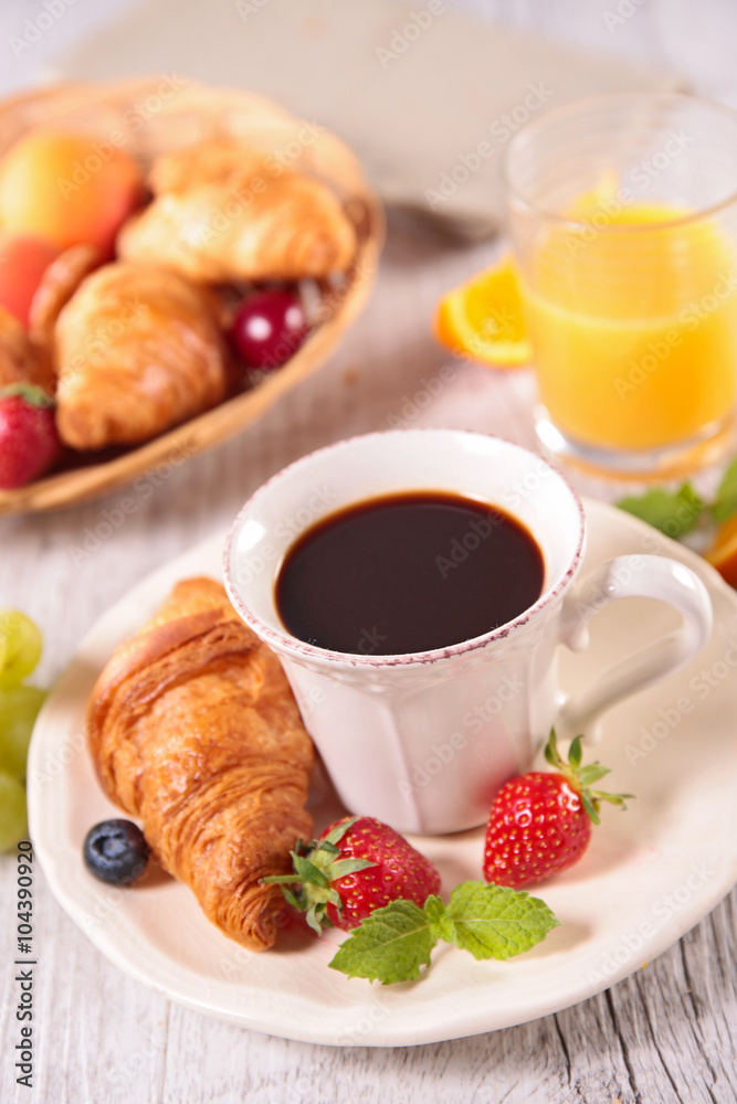coffee cup and croissant coffee cup and croissant