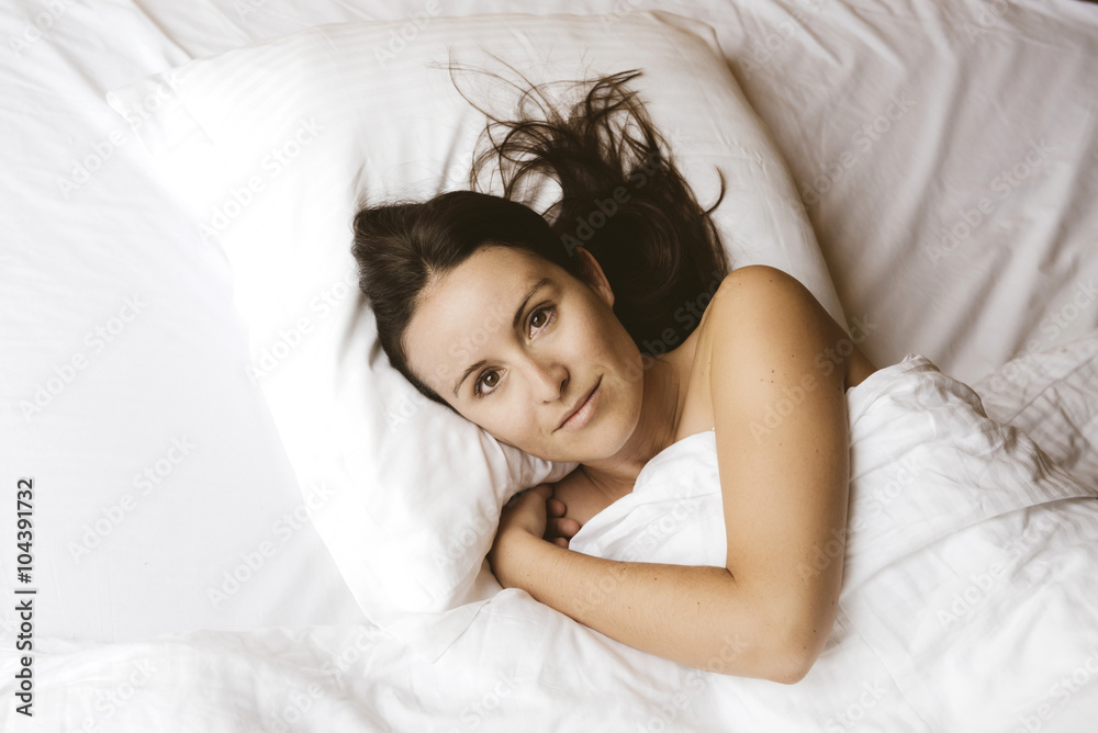 Portrait of woman between the sheets Portrait of woman between the sheets