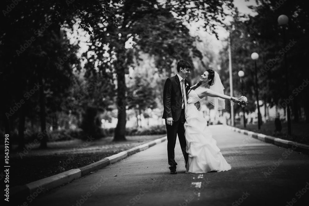 Black white photography beautiful young couple stand on background forest Black white photography beautiful young couple stand on background forest