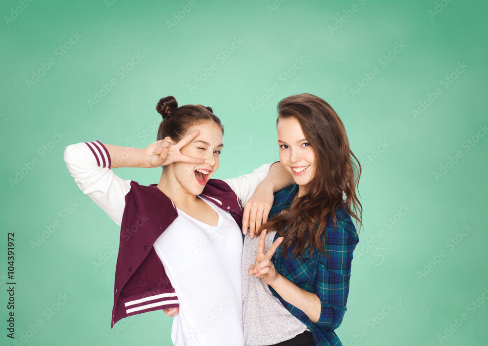 happy teenage student girls showing peace sign happy teenage student girls showing peace sign