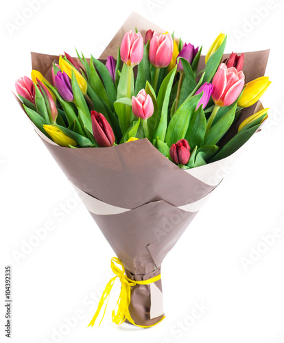 bouquet of 25 colorful tulips in kraft paper, isolated on white