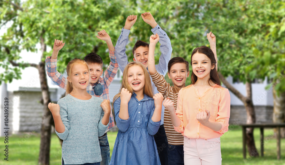 happy children celebrating victory over backyard
