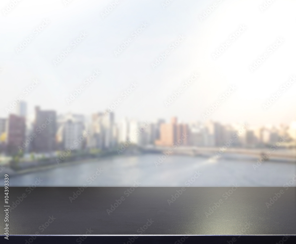 Fototapeta premium Table Top And Blur Building Of Background