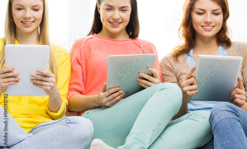 close up of young women with tablet pc at home