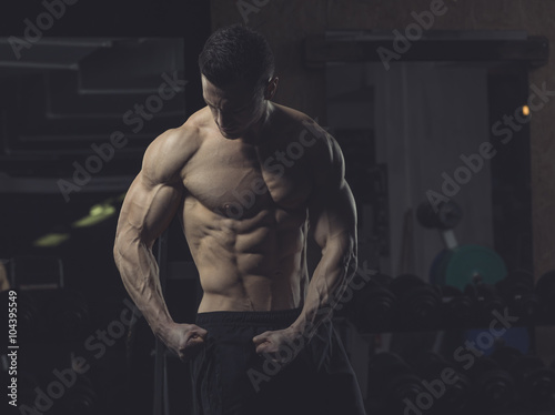 Athlete posing, muscles photo