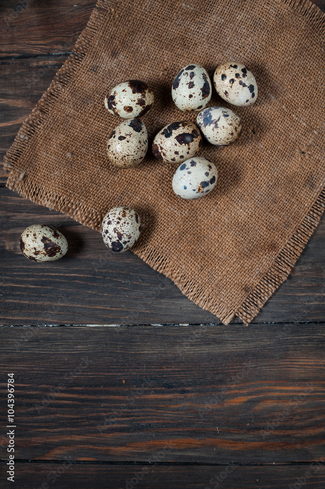 Quail eggs on a wooden table with copy space. Top view Quail eggs on a wooden table with copy space. Top view