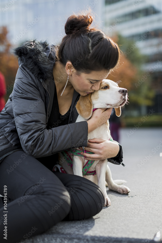 UK, London, woman cuddling her dog UK, London, woman cuddling her dog