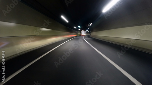 Driver POV hyperlapse through the newly built tunnel onto the highway and city lights.