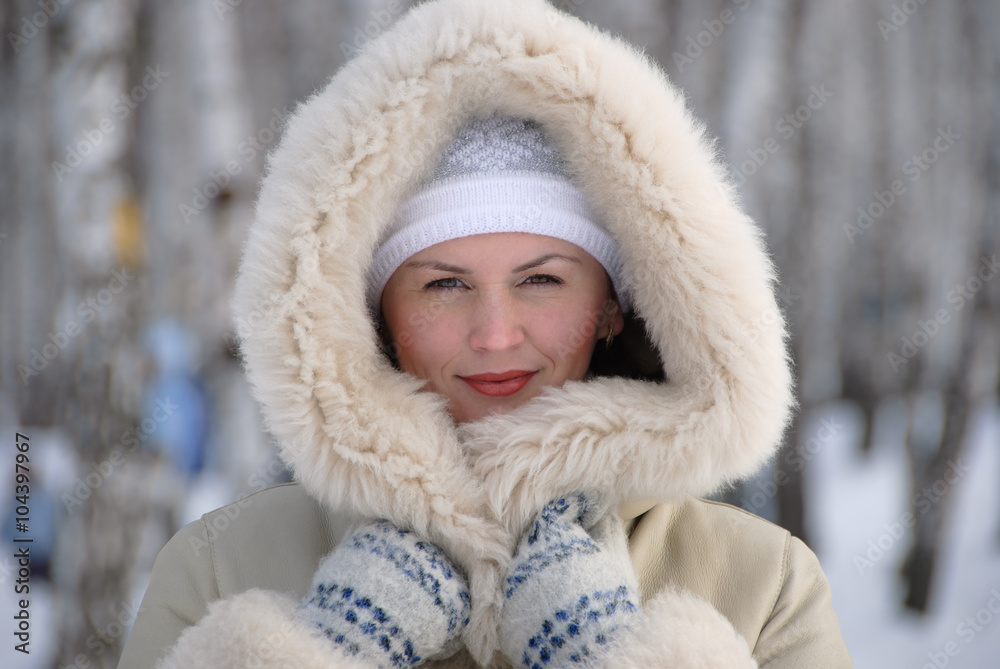 portrait of young woman in the winter snowy scenery portrait of young woman in the winter snowy scenery