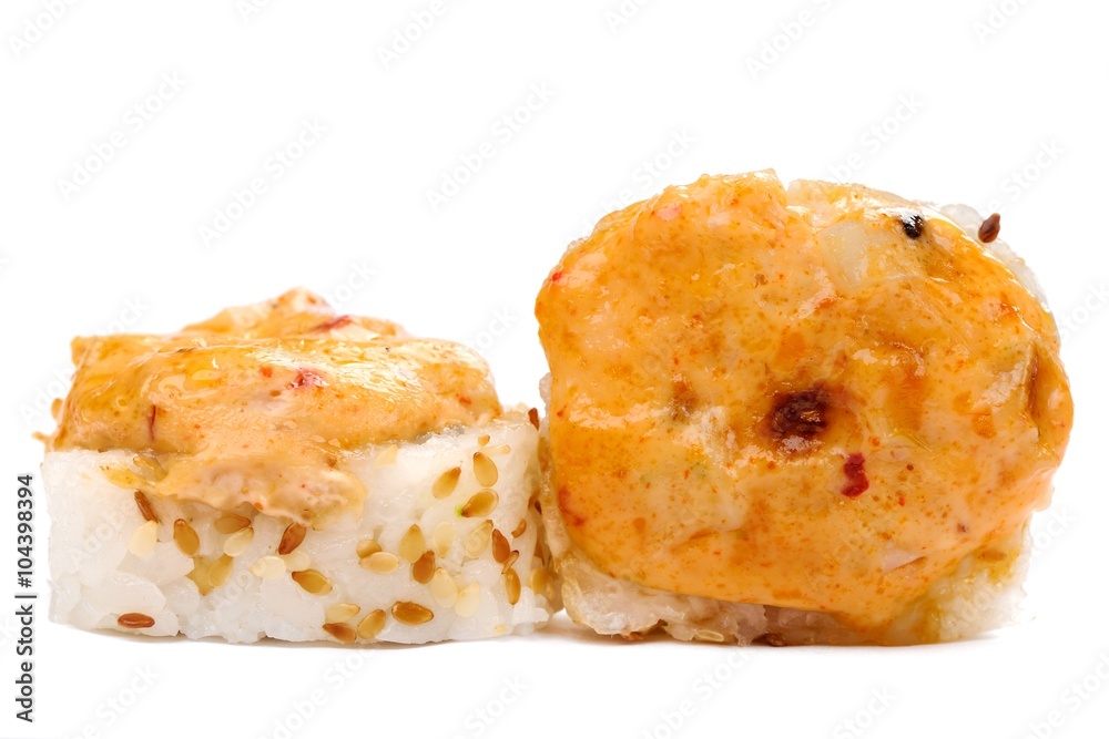 Pair of baked japanese rolls with spicy cheese isolated Pair of baked japanese rolls with spicy cheese isolated
