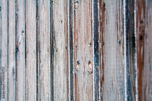 Wooden fence covered crystals of ice. Background/texture