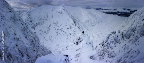 UK, Scotland, Glencoe, winter landscape at Aonach Mor with ice climber