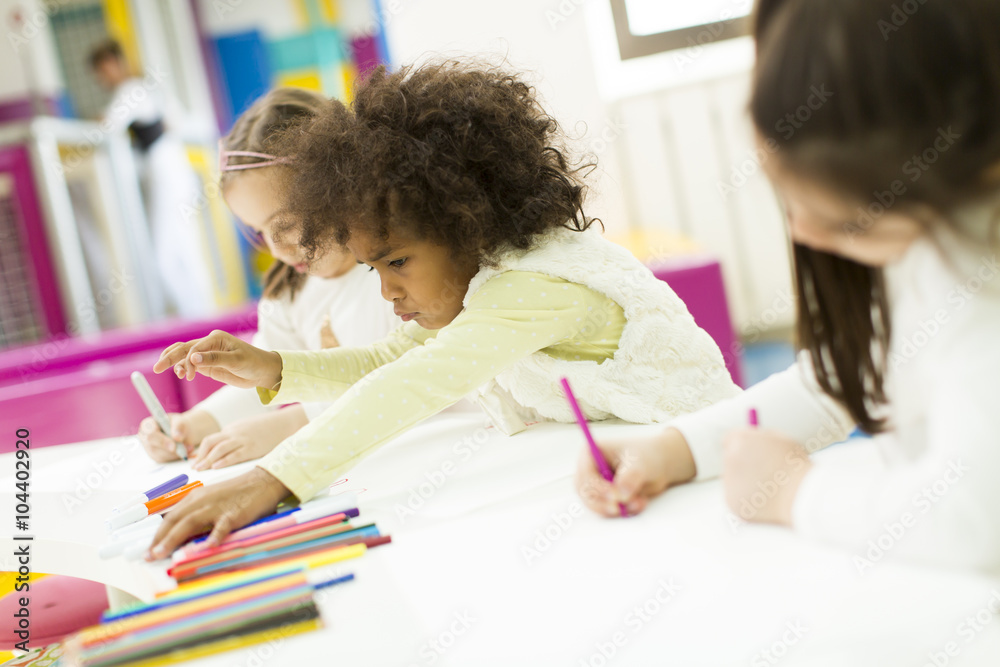 Multiracial children drawing in the playroom Multiracial children drawing in the playroom