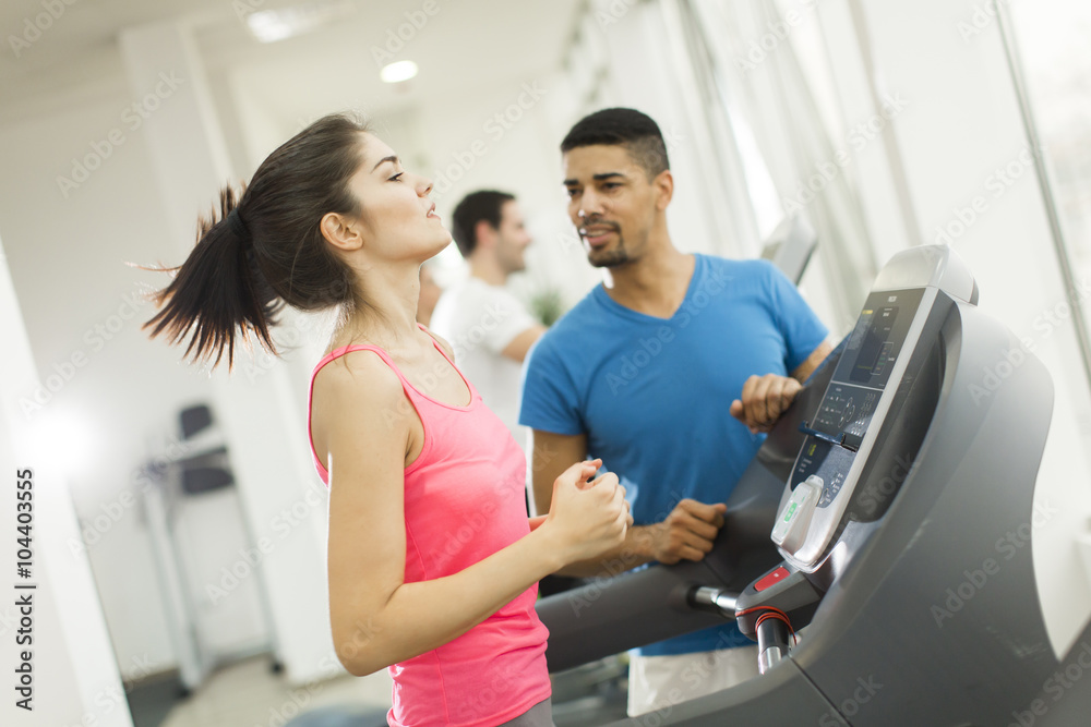 Young people training in the gym Young people training in the gym