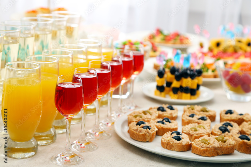 Set of cold snacks, canape, beverages, closeup