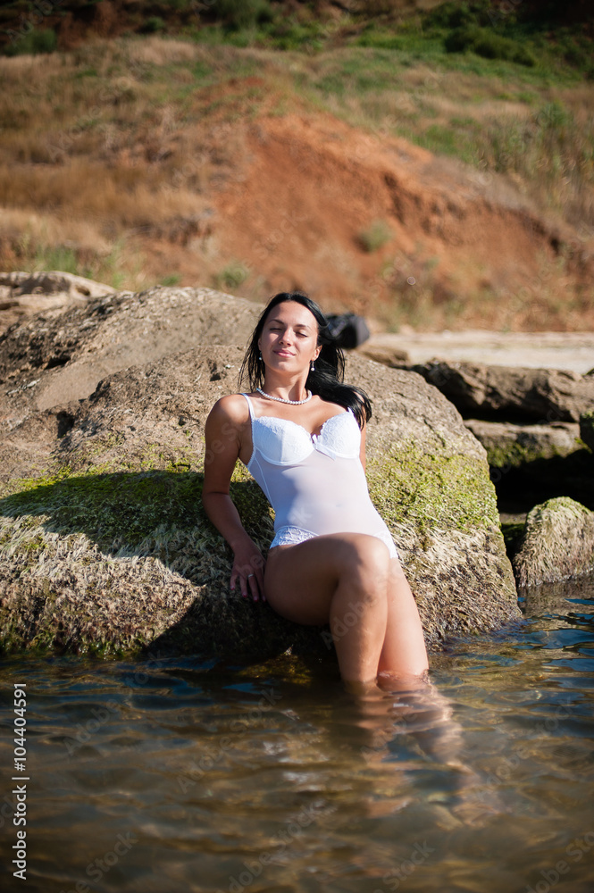 Beautiful girl sunbathing and swimming in the sea Beautiful girl sunbathing and swimming in the sea
