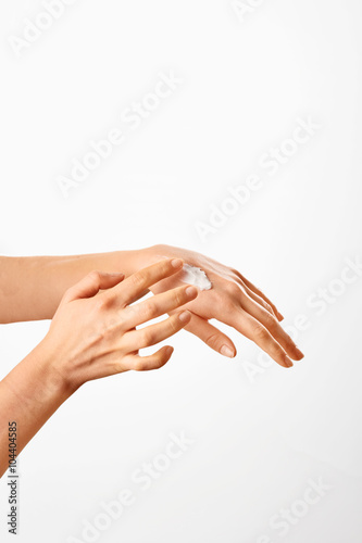 Woman applying hand cream. Beauty woman's hand