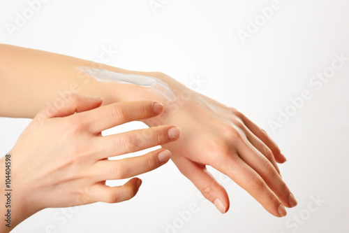Cropped shot of a woman applying lotion to her hands.Keeping her hands silky and smooth