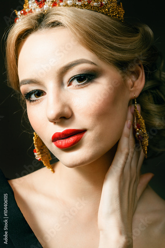Beautiful blonde girl with a golden crown