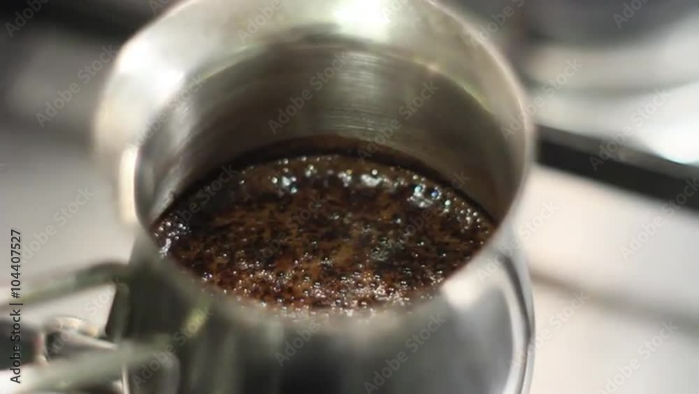 Preparing turkish coffee in a pot, cooking on a gas-stove Preparing turkish coffee in a pot, cooking on a gas-stove