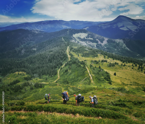 Group of hikers in the mountains, view of Carpathians mountains in Ukraine