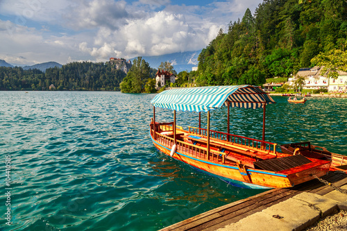 Fototapeta Naklejka Na Ścianę i Meble -  Traditional wooden boats Pletna on lake Bled