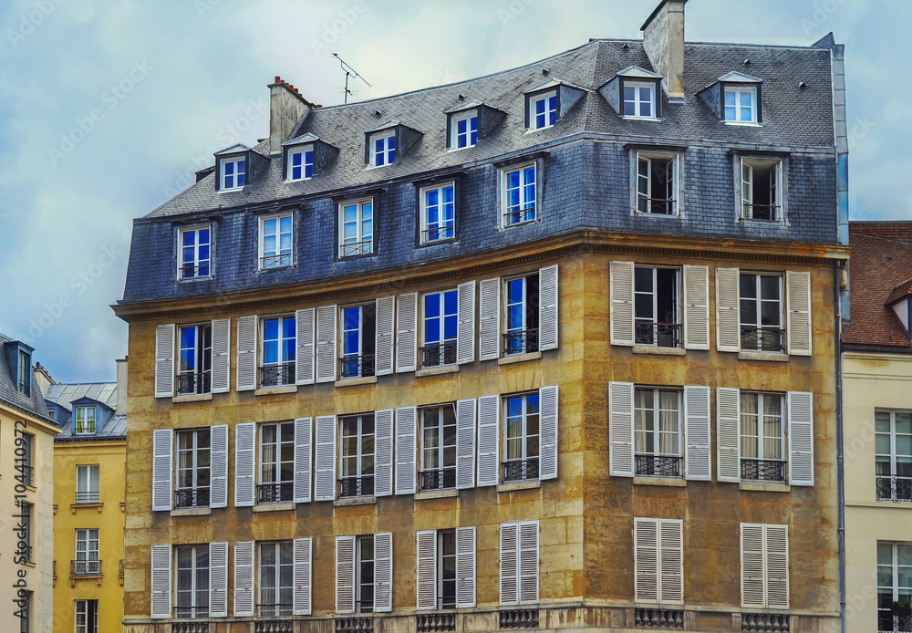 View of unique traditional French windows and balconies. Paris 