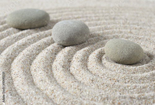 Stepping zen stones on a sand