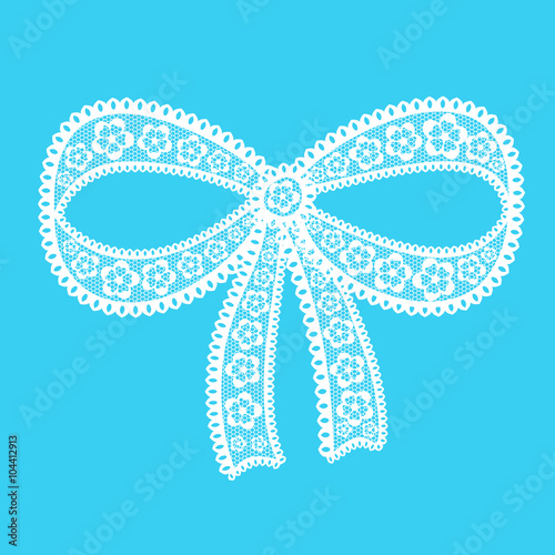 Decorative lacy bow on blue background