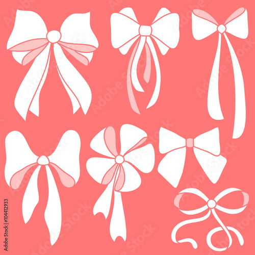 Set of white bows on red background