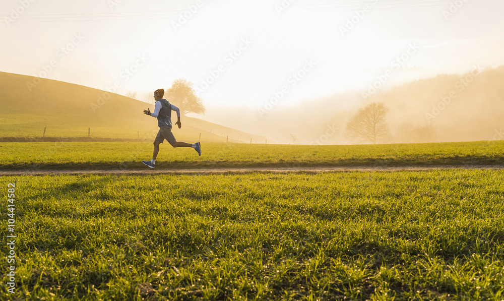 Young man jogging in the morning Young man jogging in the morning