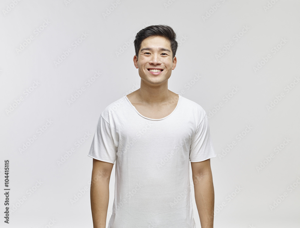 Portrait of smiling young man wearing white t-shirt Portrait of smiling young man wearing white t-shirt