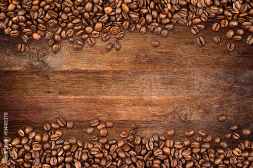 coffee background with beans on rustic old oak wood