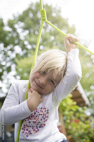 Portrait of smiling blond girl outdoors photo