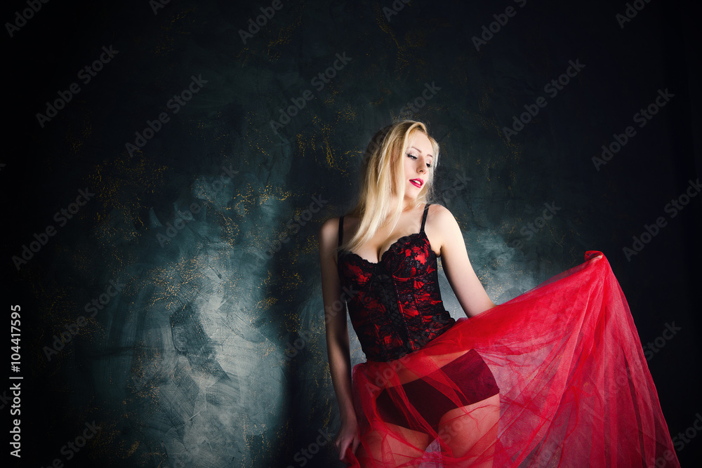 blond woman wearing beautiful long red skirt and corset